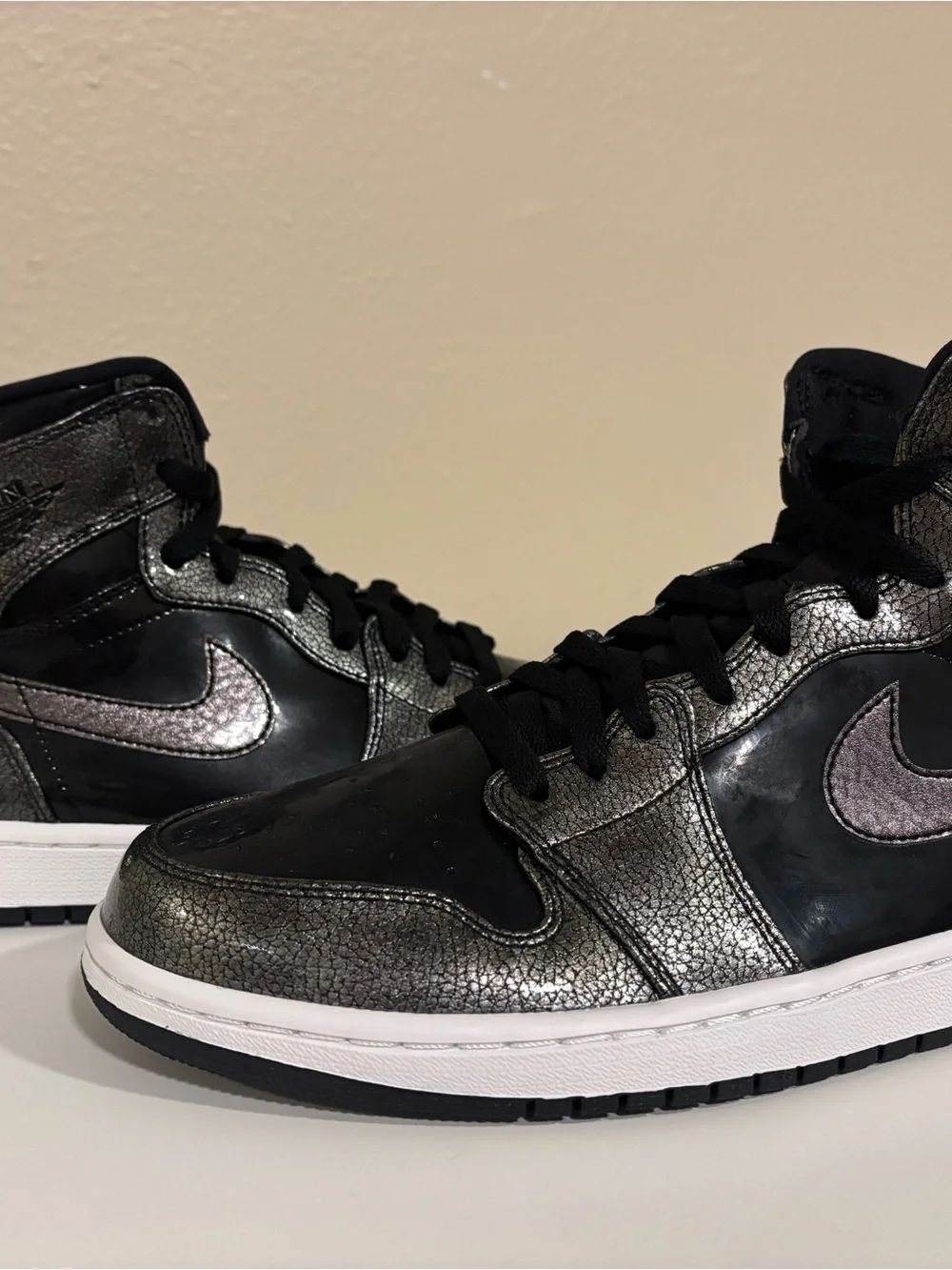 Jordan Men’s High-Top Sneakers in Black and Metallic Silver